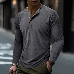 Detail of three-button Henley neckline and raglan sleeves on dark gray long sleeve T-shirt