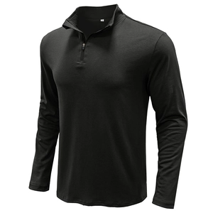 Close-up of black quarter-zip polo shirt showing stand collar and high-quality knit texture
