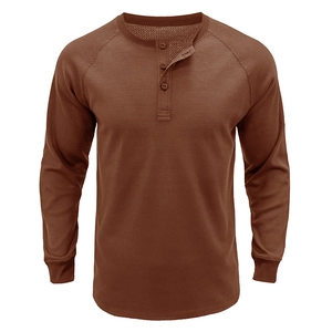 Detail of waffle knit fabric and three-button neckline on a brown long sleeve Henley shirt