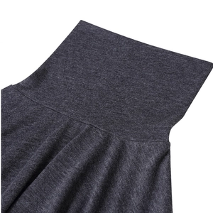 Close-up of the high turtleneck and shoulder stitching on a dark gray athletic shirt