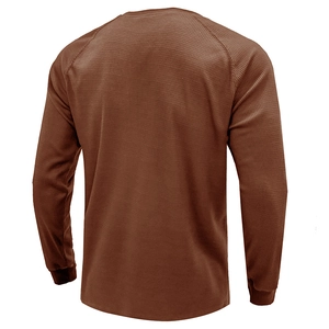 Rear view of brown waffle knit long sleeve henly shirt showing fabric texture and raglan sleeves