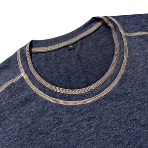 Detailed view of dark heather blue Henley t-shirt featuring contrast stitching and XL size tag