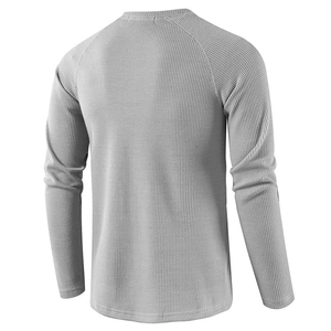 Back view of gray waffle knit long sleeve t-shirt with raglan sleeves and ribbed texture