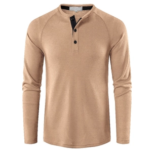 Detail of khaki waffle knit texture and three-button placket on men's Henley shirt