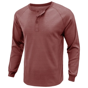 Detailed close-up of waffle knit fabric and three-button placket on men's Henley shirt