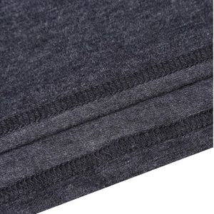 Macro detail of charcoal grey knitted fabric featuring double-needle stitching on seams