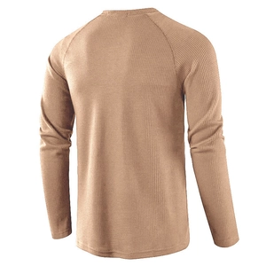 Back view of khaki waffle knit long sleeve henley shirt showing raglan sleeve detail