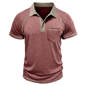 Close-up of men's polo shirt featuring contrast stitching and wooden buttons on the chest pocket