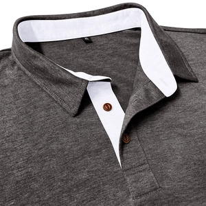 Detail of dark gray polo shirt featuring contrast white collar and brown buttons