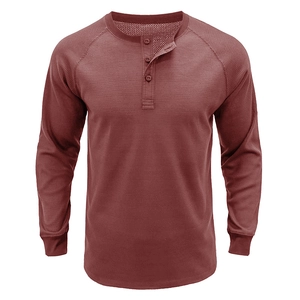Detail of waffle knit fabric and three-button placket on this men's brick red Henley shirt