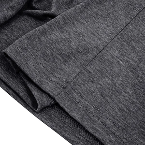 Macro shot of dark grey knit fabric showing double-needle hem and precise stitching details