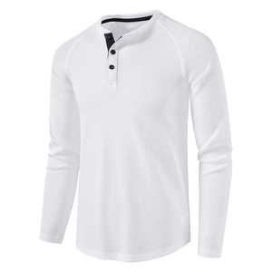 Close-up of white waffle knit Henley shirt featuring a three-button placket and raglan sleeves