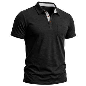 Detail of dark gray men's polo shirt with orange button accents and contrast collar lining