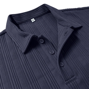 Detailed view of deep blue pleated fabric texture and three-button collar on polo shirt
