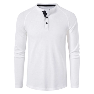 Close-up of white waffle knit Henley shirt with black contrast inner placket and buttons
