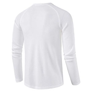 Detail view of white waffle knit long sleeve shirt showing raglan sleeves and texture