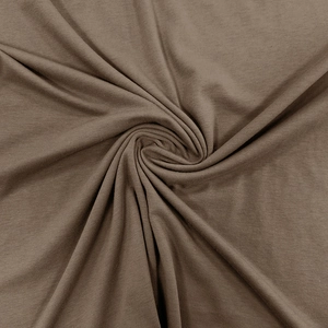Close-up of brown knitted fabric texture showing soft drape and fine ribbed knit patterns