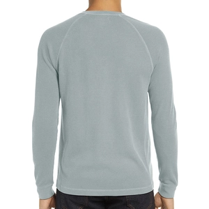 Rear view of long sleeve waffle knit Henley shirt in light blue gray showing texture