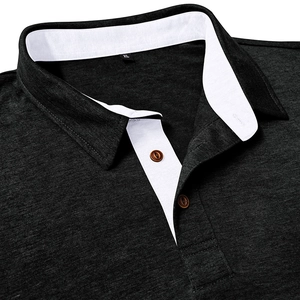 Detailed close-up of dark grey heather texture Polo shirt with white collar and wood buttons