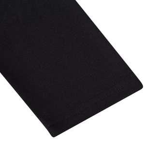 Macro view showing high-quality double-needle stitching on the black t-shirt cuff hem