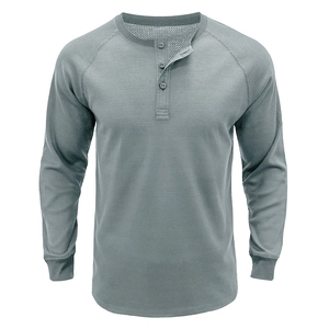 Detail of grey waffle-knit long sleeve Henley shirt featuring three-button placket and raglan sleeves