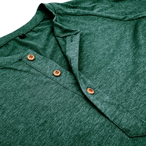 Close-up of olive green Henley collar with wooden buttons and textured fabric