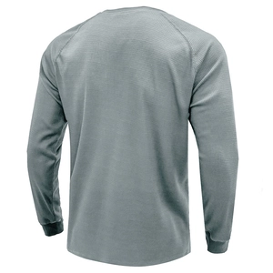 Rear view of grey waffle-knit long sleeve shirt with comfortable raglan sleeve design