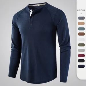 Men's navy blue waffle knit henley shirt with long sleeves and three-button neckline