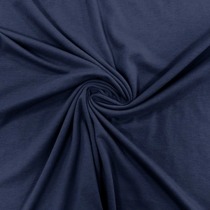 Detailed close-up of navy blue knitted cotton fabric texture and soft drape on men's polo shirt