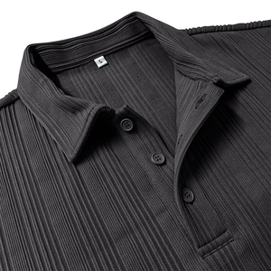 Macro shot of dark grey polo shirt showing vertical pleated texture and three-button collar