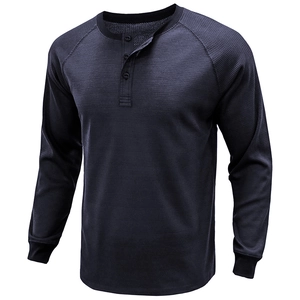 Macro shot of navy waffle knit texture and three-button placket on men's long sleeve henley