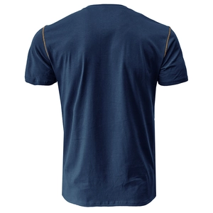 Detail view of navy short sleeve shirt showing orange contrast stitching on shoulders