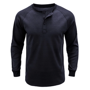 Detailed close-up of navy waffle knit texture and three-button Henley collar on men's shirt