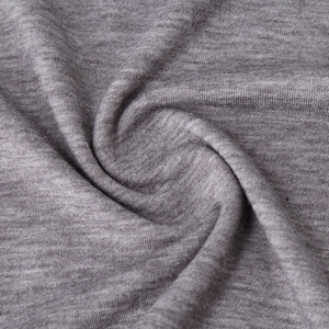 Macro shot of light heather grey knitted fabric texture for men's thermal fitness t-shirt