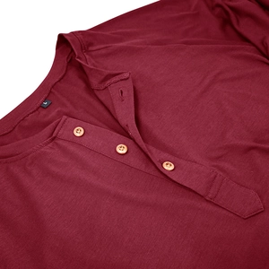 Detail of burgundy Henley neck with three buttons and premium textured knit fabric