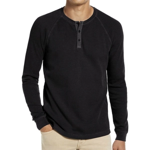 Men's black waffle knit long sleeve Henley shirt with buttoned collar and ribbed cuffs