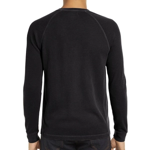 Back view of a men's black waffle knit long-sleeve T-shirt with raglan sleeve design