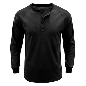 Detail of waffle knit fabric and three-button placket on black men's Henley shirt