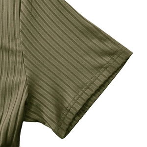 Detail of olive green knitted sports shirt showing rib-knit texture and flat stitching