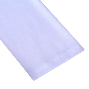 Macro shot of white athletic long sleeve cuff with durable double-needle stitching