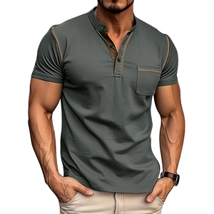 Detail of dark olive green Henley shirt with contrasting stitching and breast pocket