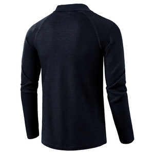 Men's navy waffle knit long sleeve polo shirt with raglan sleeves and textured finish