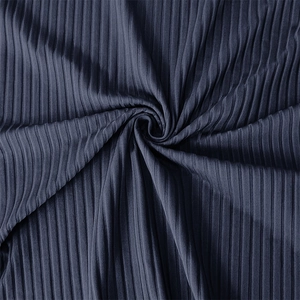 Macro shot of dark grey ribbed knit fabric showing soft texture and vertical stripe detail