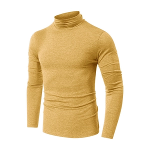 Close-up of mustard yellow men's mock neck long sleeve shirt with premium knit texture