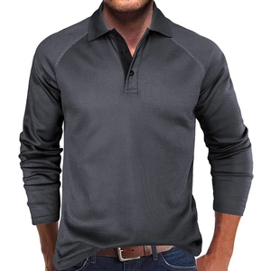Detailed view of the dark grey waffle knit texture on a long-sleeve polo shirt for men