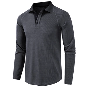 Close-up of waffle textured long sleeve polo shirt with black contrast collar and grey fabric