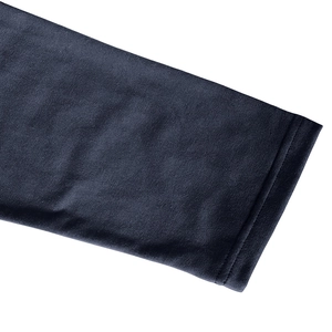 Macro detail of navy blue knit fabric with durable double-needle stitching on the hem