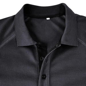 Detail of grey waffle knit texture and ribbed polo collar with black buttons