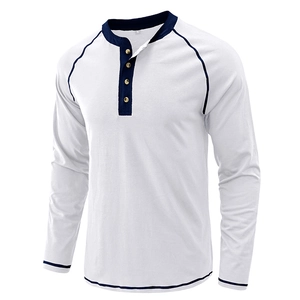 Close-up of men's white cotton long sleeve Henley shirt featuring navy blue contrast trim