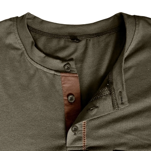 Detail of olive green Henley shirt collar with three buttons and brown contrast lining